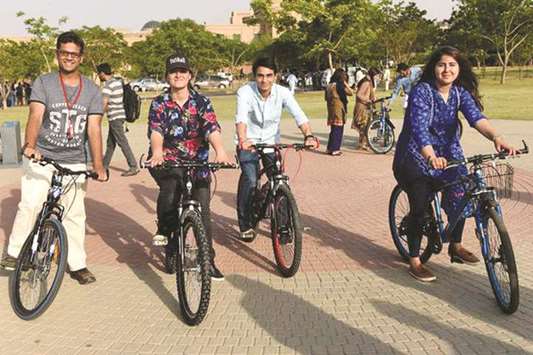 A group of students riding bikes at the soft launch of CYKIQ at NUST campus, Islamabad in May.