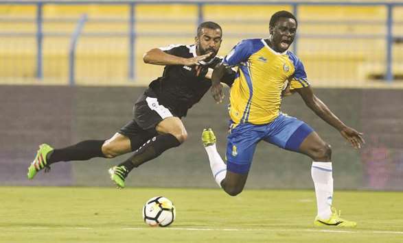 Al Gharafa and Umm Salal players vie for the ball during the QNB Stars League. PICTURE: Anas Khalid
