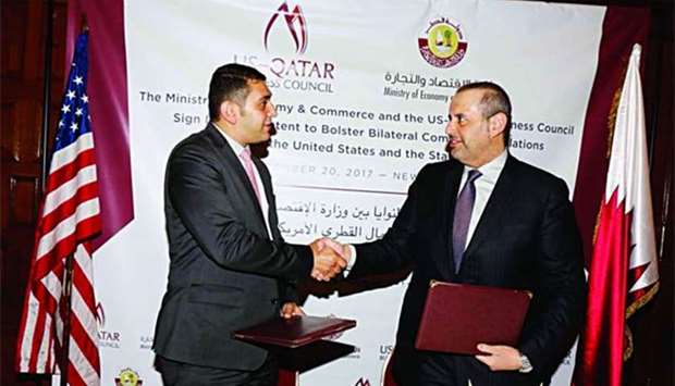 HE the Minister of Economy and Commerce Sheikh Ahmed bin Jassim bin Mohamed al-Thani and Executive Director of the US-Qatari Business Council Mohamed Barakat shake hands after signing the letter of intent.