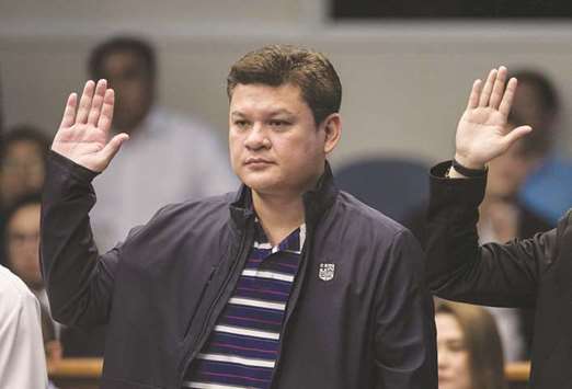 Davao City Vice Mayor Paolo Duterte, son of Philippine President Rodrigo Duterte, taking an oath as he attends a Senate hearing in Manila.