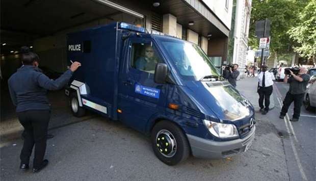 A police van believed to be carrying Ahmed Hassan leaves Westminster magistrates court after the teenager was charged with attempted murder following last week's bombing of a London Underground train in London on Friday.