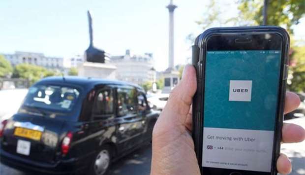 A Uber app is displayed on a mobile phone in London on Friday.