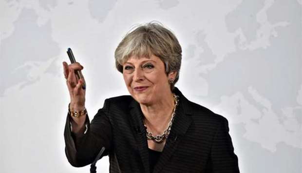 British Prime Minister Theresa May gestures as she delivers a speech aimed at unlocking Brexit talks, in Florence, Italy on Friday.