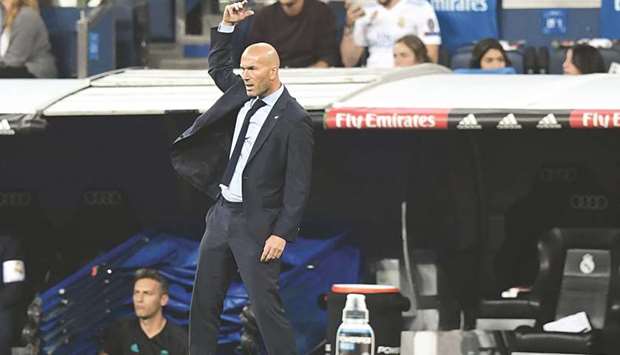 Real Madridu2019s coach from France Zinedine Zidane gestures during the La Liga match against Real Betis at the Santiago Bernabeu stadium in Madrid. (AFP)