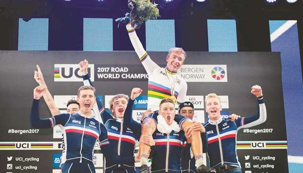 Benoit Cosnefroy of France is lifted by his teammates as he celebrates after winning the UCI World Road Championships menu2019s under-23 title in Bergen, Norway, yesterday. (AFP)