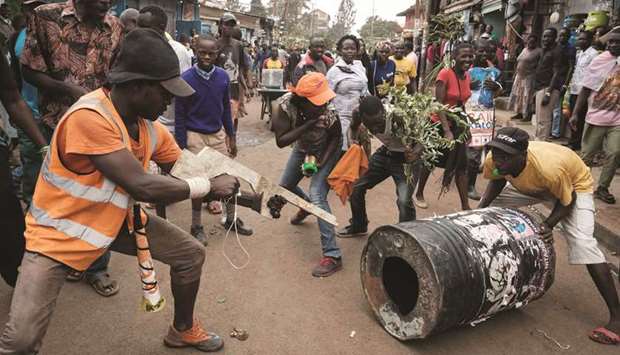 Supporters of Kenyau2019s opposition National Super Alliance (NASA) celebrate on a street of Kibera slum in Nairobi after the Supreme Court ordered a new presidential election.