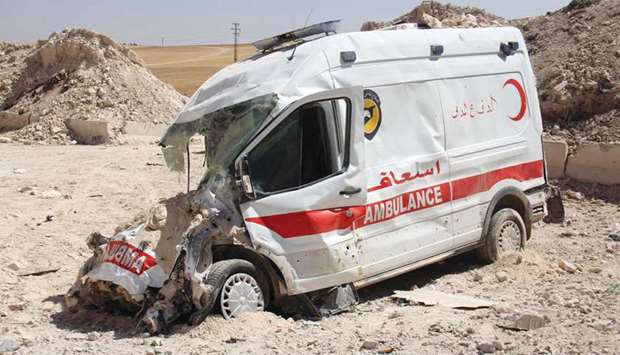 A destroyed ambulance from the Syrian Civil Defence is seen in the town of Khan Sheikun in Idlib province yesterday, following reported Russian air strikes.