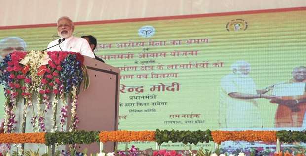 Prime Minister Narendra Modi addresses a gathering at Shahanshahpur in Varanasi yesterday.