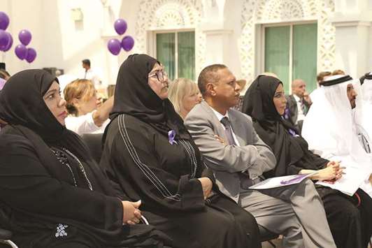 Participants attend presentations at an event on various types of dementia.