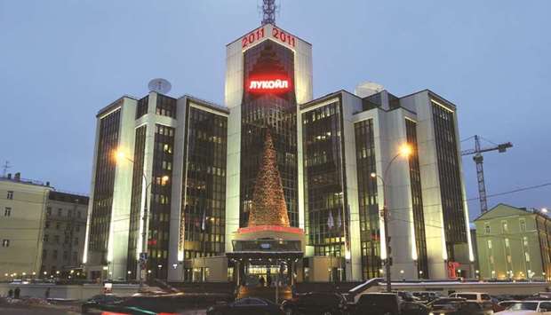 The Lukoil headquarters is seen illuminated in Moscow. Lukoil plans to keep pumping 100mn tonnes of oil per year between 2018 and 2027 with projects outside Russia and will keep annual investment at $8bn-$8.5bn, its chief executive said yesterday.