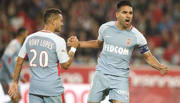Monacou2019s Radamel Falcao celebrates scoring their third goal against Lille with Rony Lopes. (Reuters)