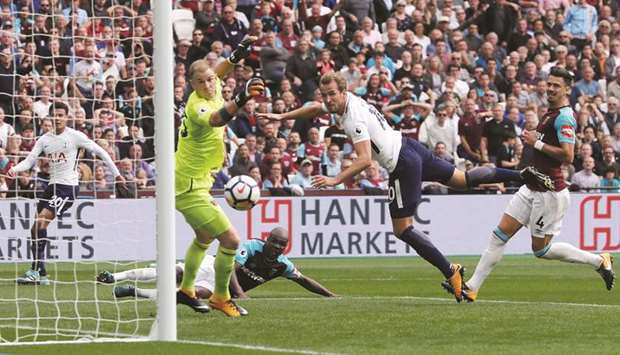 Tottenham Hotspuru2019s Harry Kane scores against West Ham at London Stadium yesterday. (Reuters)