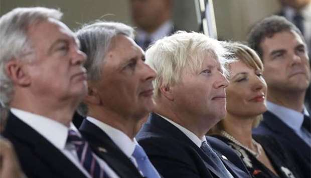 Brexit Minister David Davis, Chancellor of the Exchequer Philip Hammond and Foreign Secretary Boris Johnson attend a speech by the British prime minister aimed at unlocking Brexit talks, in Florence on Friday.