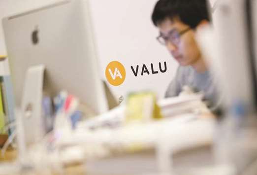 A man works at the company office running Valu, the web-based virtual exchange where people can raise bitcoins by u2018listing themselvesu2019, in Tokyo. An official from the Financial Services Agency said it had been watching the Valu exchange, but would only advise it to inform investors that listings did not require financial disclosure.