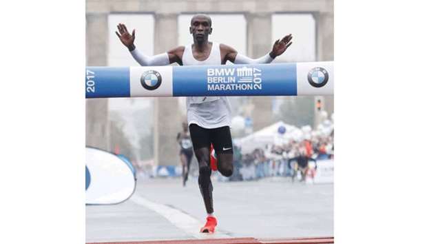 Eliud Kipchoge of Kenya crosses the finish line to win the Berlin Marathon in Berlin yesterday. (AFP)