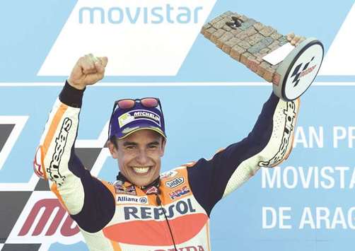 Repsol Honda Teamu2019s Spanish rider Marc Marquez celebrates on the podium winning the MotoGP race of the Moto Grand Prix of Aragon at the Motorland circuit in Alcaniz yesterday. (AFP)