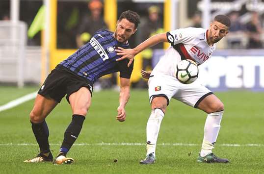 Inter Milanu2019s Danilo Du2019Ambrosio (left) vies for the ball with Genoau2019s Adel Taarabt during the Serie A match at San Siro Stadium in Milan. (Reuters)