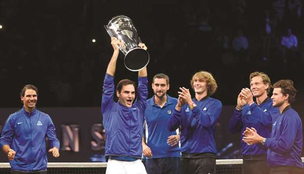 Roger Federer of Team Europe and his teammates celebrate with the Laver Cup trophy in O2 Arena in Prague yesterday. (AFP)