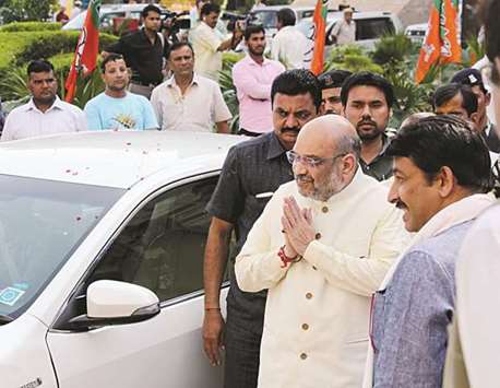 BJP president Amit Shah acknowledges the greeting of supporters as he arrives for the partyu2019s office bearersu2019 meeting in New Delhi yesterday.