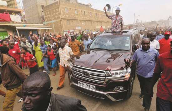 Opposition leader Raila Odinga arrives at a rally in the Kawangware suburb of Nairobi.