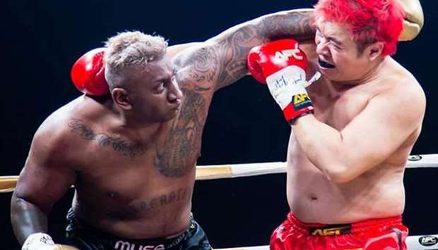 Pradip Subramanian (left) faces off against Steven Lim during their Asia Fighting Championship match. (Photo: Facebook/Asia Fighting Championship) 
