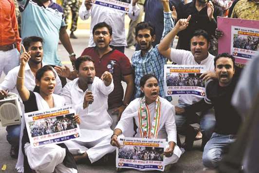 Congress activists stage a demonstration against the Uttar Pradesh government after police baton charged students of the Banaras Hindu University (BHU) while they were agitating against the molestation of a student inside the campus, in New Delhi yesterday.