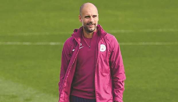 Manchester City manager Pep Guardiola at a team training session yesterday. (AFP)