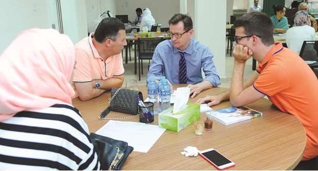 A parent consults a university officials during the open house. PICTURE: Ram Chand