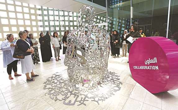 Community members enjoy a guided Art Trail tour in Education City.