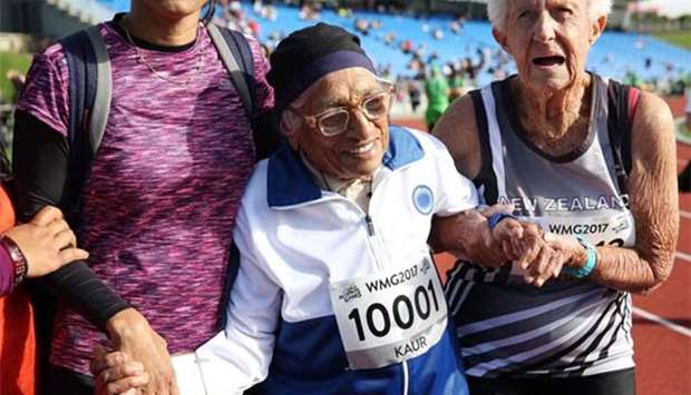 Indian runner Man Kaur, 101, celebrates after competing in the 100m sprint in the 100+ age category at the World Masters Games in Auckland in April this year.