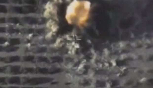 A still image taken from a video footage and released by Russia's Defence Ministry on September 25, 2017, shows a missile hitting a target which Defence Ministry said was an Islamic State position in Syria
