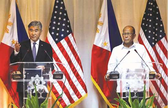 US ambassador to Manila Sung Kim (left) and Philippine Defence Secretary Delfin Lorenzana answer questions during a press conference at the military headquarters in Camp Aguinaldo, Quezon City, Metro Manila, yesterday.