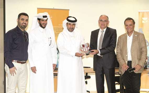 Secretary General of the Qatar Olympic Committee Dr Thani bin Abdulrahman al-Kuwari (centre) with officials of the Barcelona and LIeida Spanish Universities during the agreement signing ceremony in Doha yesterday.