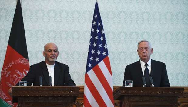 US Defense Secretary Jim Mattis (R) speaks next to Afghan President Ashraf Ghani
