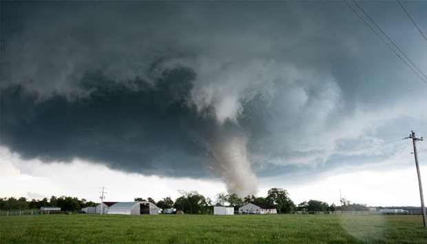A tornado rips through a residential area after touching down south of Wynnewood