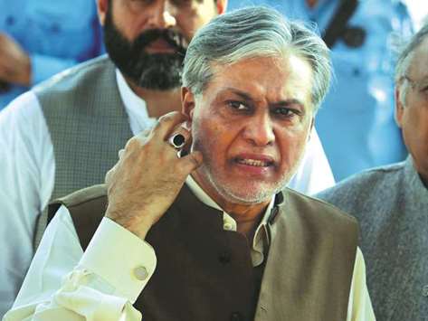 Pakistanu2019s Finance Minister Ishaq Dar is seen after a party meeting in Islamabad yesterday.