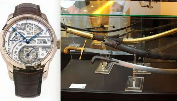 The  James Pellaton watch sold for $480,000. Right: A collection of swords at the auction.