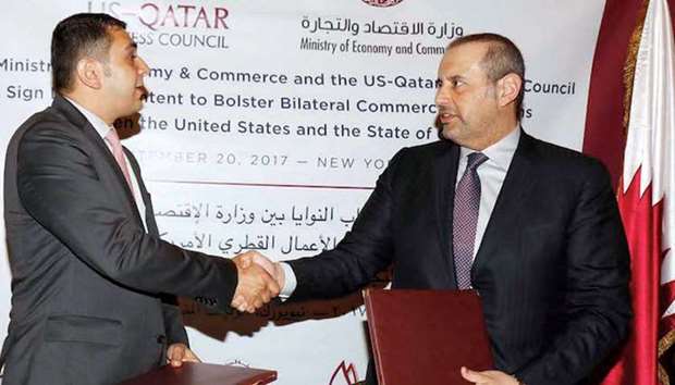 HE Sheikh Ahmed (right) and Barakat shake hands after signing the letter of intent at the University Club in New York City on Wednesday.
