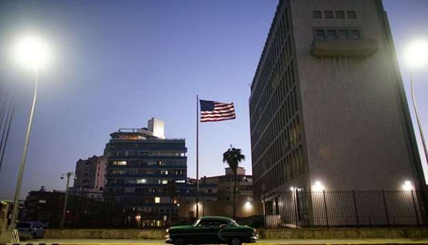 A vintage car passes by in front of the US Embassy in Havana, Cuba, January 12, 2017