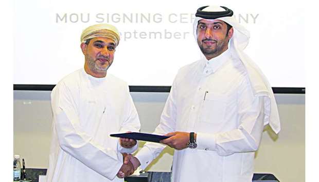 Dr Hamad al-Ibrahim and Yousuf al-Harthy at the MoU-signing ceremony.