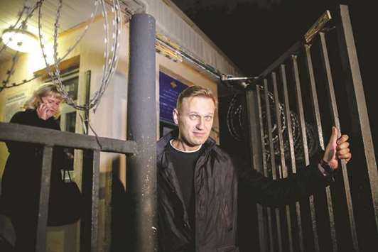 Navalny leaves the police station in Moscow last night. He will face a court hearing in Moscow on October 2 over repeatedly violating a law on organising public meetings.