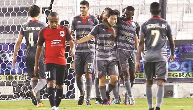 Al Duhailu2019s Nam Tae-Hee (centre) celebrates with teammates after scoring against Al Rayyan in the QNB Stars League yesterday. PICTURE: Jayan Orma