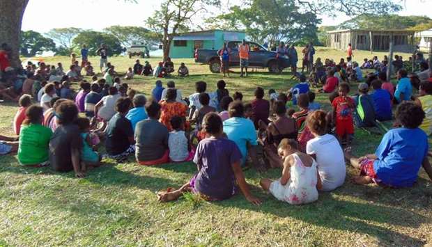 Vanuatu Red Cross personnel talking to local residents on the island of Ambae