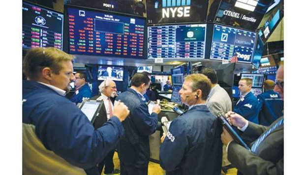 Traders work on the floor of the New York Stock Exchange. All four major US equity gauges u2013 the S&P 500, Nasdaq Composite Index, Dow Jones Industrial Average and Russell 2000 Index u2013 ended September with year-to-date gains of at least 9%.