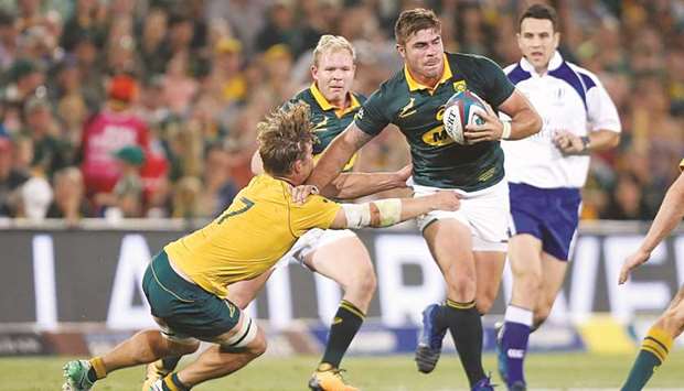 South Africau2019s Malcolm Marx (right) is challenged by Australiau2019s Michael Hooper during the Rugby Championship match at the Toyota Stadium in Bloemfontein, South Africa, yesterday. (Reuters)