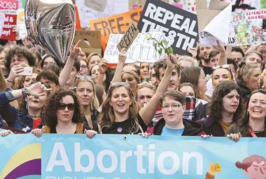 Protesters hold up placards as they take part in the March for Choice in Dublin yesterday.
