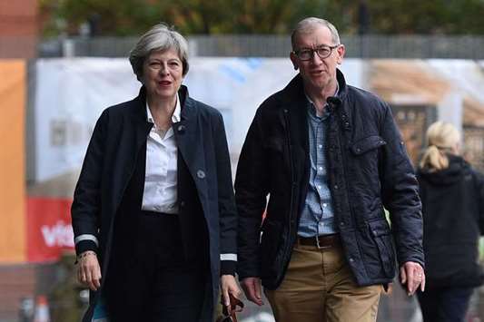 Prime Minister Theresa May and husband Philip arrive at the Midland Hotel in Manchester yesterday ahead of the Conservative party annual conference.