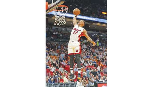The Miami Heatu2019s Rodney McGruder with a soaring dunk against Toronto Raptors at the AmericanAirlines Arena in Miami on March 23, 2017. (Charles Trainor Jr./Miami Herald/TNS)