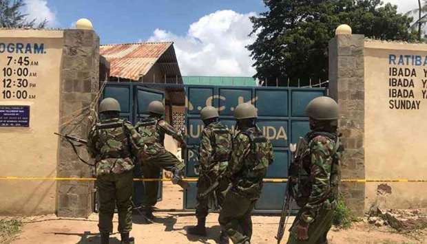 The assailants shot at the officers who were guarding a church and grabbed their guns, killing one on the spot while the other died in hospital.