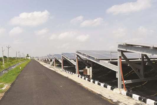 Indiau2019s first 1 MW canal-top solar power project in Ahmedabad. Air pollution is  diminishing Indiau2019s capacity to harness power from the sun, experts say,  undermining billions being invested in renewables as the energy-hungry giant emerges as a new solar superpower.